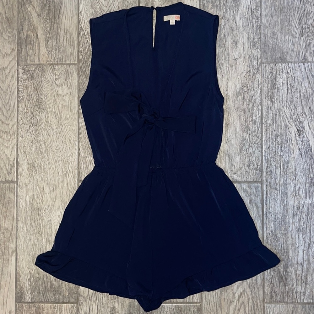 Navy romper with bow in the front